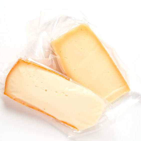 Vacuum wrapped plastic cheese packaging.